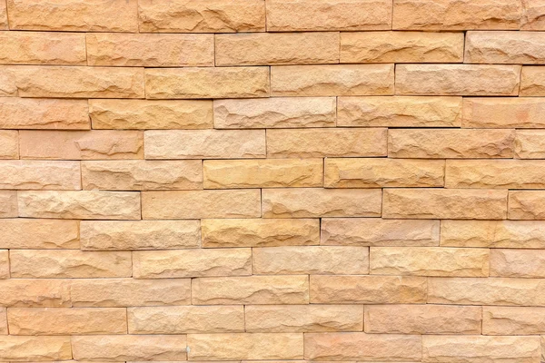 Stone orange brick stick in the wall as a background texture — Stock Photo, Image