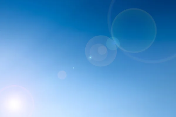 Clear blue sky with len flare as a background wallpaper, pastel sky wallpaper — Stock Photo, Image