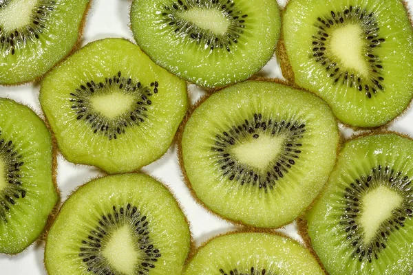 Close-up van bovenaanzicht macro kiwi fruit segmenten voor achtergrond — Stockfoto