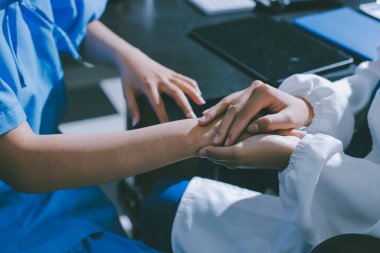 Male doctors shake hands with patients encouraging each other and praying for blessings. To offer love, concern, and encouragement while checking the patient's health. concept of medicine