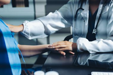 Male doctors shake hands with patients encouraging each other and praying for blessings. To offer love, concern, and encouragement while checking the patient's health. concept of medicine