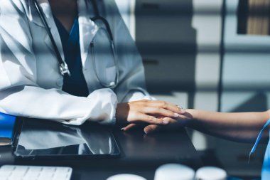 Male doctors shake hands with patients encouraging each other and praying for blessings. To offer love, concern, and encouragement while checking the patient's health. concept of medicine