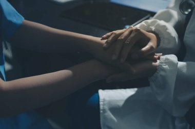 Male doctors shake hands with patients encouraging each other and praying for blessings. To offer love, concern, and encouragement while checking the patient's health. concept of medicine