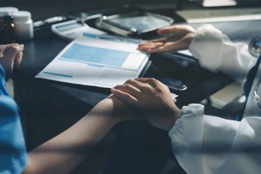 Male doctors shake hands with patients encouraging each other and praying for blessings. To offer love, concern, and encouragement while checking the patient's health. concept of medicine