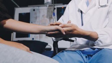 doctor giving hand to patient in hospital
