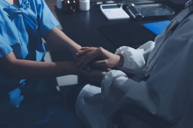 Male doctors shake hands with patients encouraging each other and praying for blessings. To offer love, concern, and encouragement while checking the patient's health. concept of medicine
