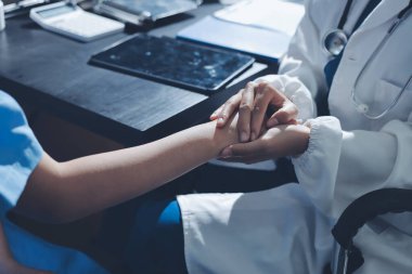 Male doctors shake hands with patients encouraging each other and praying for blessings. To offer love, concern, and encouragement while checking the patient's health. concept of medicine