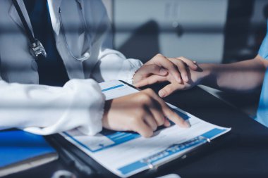 Male doctors shake hands with patients encouraging each other and praying for blessings. To offer love, concern, and encouragement while checking the patient's health. concept of medicine
