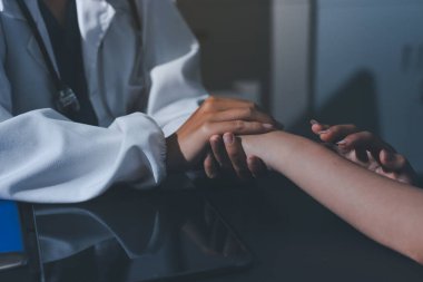 Male doctors shake hands with patients encouraging each other and praying for blessings. To offer love, concern, and encouragement while checking the patient's health. concept of medicine