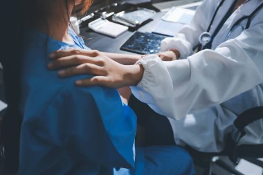 Male doctors shake hands with patients encouraging each other and praying for blessings. To offer love, concern, and encouragement while checking the patient's health. concept of medicine