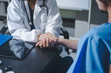 Male doctors shake hands with patients encouraging each other and praying for blessings. To offer love, concern, and encouragement while checking the patient's health. concept of medicine