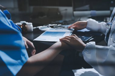Male doctors shake hands with patients encouraging each other and praying for blessings. To offer love, concern, and encouragement while checking the patient's health. concept of medicine