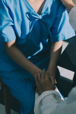 Male doctors shake hands with patients encouraging each other and praying for blessings. To offer love, concern, and encouragement while checking the patient's health. concept of medicine