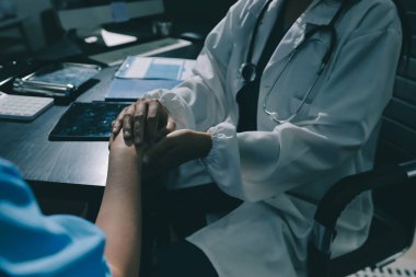 Male doctors shake hands with patients encouraging each other and praying for blessings. To offer love, concern, and encouragement while checking the patient's health. concept of medicine