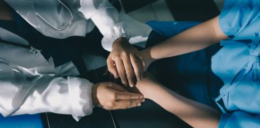 Male doctors shake hands with patients encouraging each other and praying for blessings. To offer love, concern, and encouragement while checking the patient's health. concept of medicine