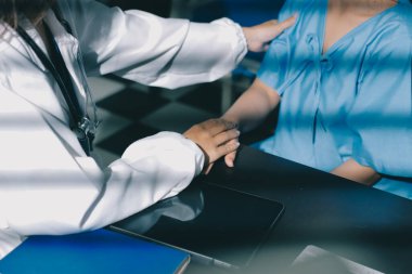 Male doctors shake hands with patients encouraging each other and praying for blessings. To offer love, concern, and encouragement while checking the patient's health. concept of medicine