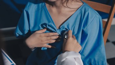healthy concept; Doctor checking patient's heart with stethoscope at a hospital