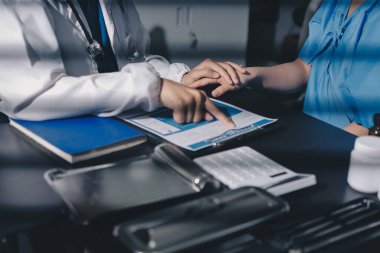 Male doctors shake hands with patients encouraging each other and praying for blessings. To offer love, concern, and encouragement while checking the patient's health. concept of medicine