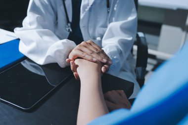 Male doctors shake hands with patients encouraging each other and praying for blessings. To offer love, concern, and encouragement while checking the patient's health. concept of medicine