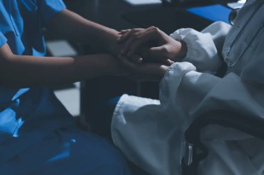 Male doctors shake hands with patients encouraging each other and praying for blessings. To offer love, concern, and encouragement while checking the patient's health. concept of medicine