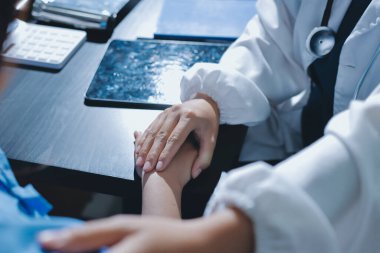 Male doctors shake hands with patients encouraging each other and praying for blessings. To offer love, concern, and encouragement while checking the patient's health. concept of medicine