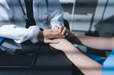 Male doctors shake hands with patients encouraging each other and praying for blessings. To offer love, concern, and encouragement while checking the patient's health. concept of medicine