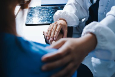 Male doctors shake hands with patients encouraging each other and praying for blessings. To offer love, concern, and encouragement while checking the patient's health. concept of medicine