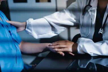 Male doctors shake hands with patients encouraging each other and praying for blessings. To offer love, concern, and encouragement while checking the patient's health. concept of medicine