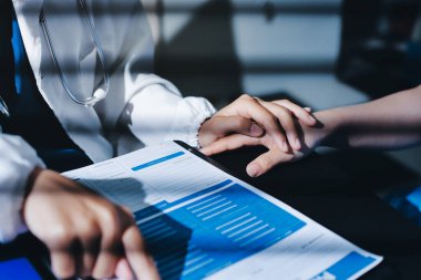 Male doctors shake hands with patients encouraging each other and praying for blessings. To offer love, concern, and encouragement while checking the patient's health. concept of medicine