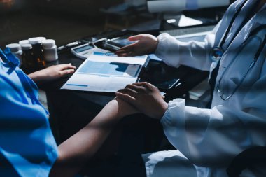 Male doctors shake hands with patients encouraging each other and praying for blessings. To offer love, concern, and encouragement while checking the patient's health. concept of medicine