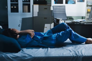 A patient with depression looks outside.