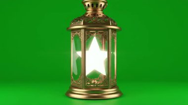 Içinde bir yıldız olan altın bir Ramazan feneri, canlı yeşil ekran arka planına kurulmuş. Tatil temalı projeler ve dini kutlamalar için mükemmel..