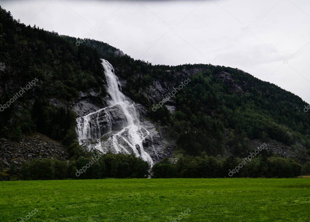 Panoramic view to Vidfossen waterfall at Gronsdalslona river in Odda , Norway