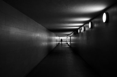Man exiting underground corridor clipart