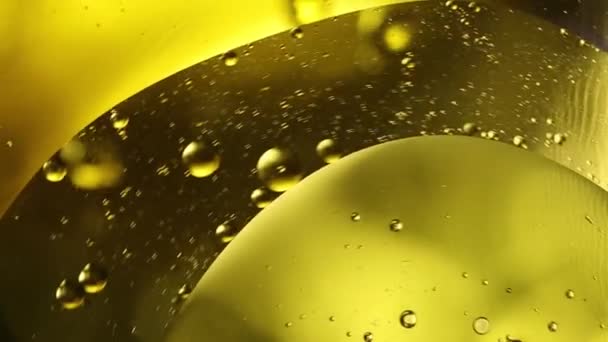 Bright Yellow Moving Circles Liquid Bubbles Olive Oil Beer Drink — Stock Video