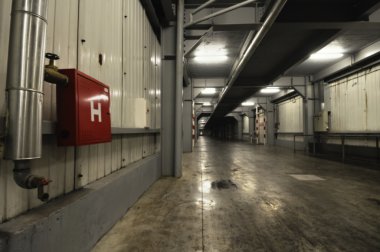 big underground corridor in warehouse clipart
