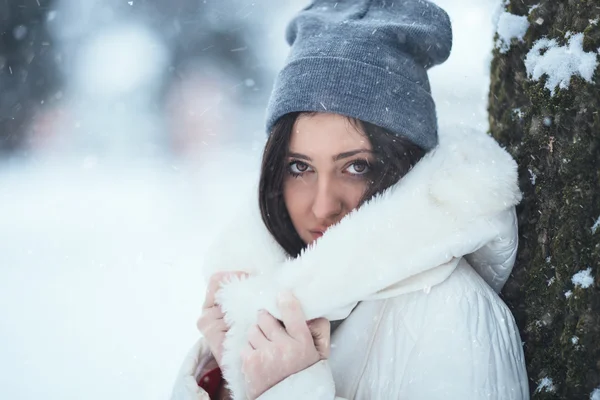 Woman holding hood with both hands — Stock Photo, Image