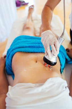 Cavitation RF body treatment and contemporary medicine for health beauty improvement and fat and cellulite removal clipart