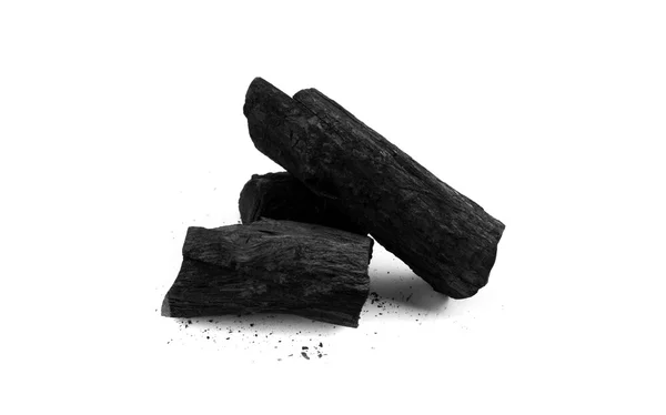 Zwarte houtskool en puin op witte achtergrond — Stockfoto