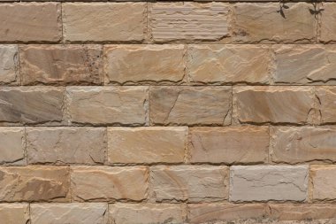 Bu soyut arkaplan fotoğrafında, Avustralya 'nın Queensland şehrindeki Gold Coast' ta çekilen desenli dokulu tuğlalardan oluşan düzenli bir kalıp..