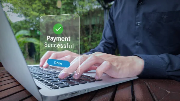 Online Payment Confirmation on Laptop in Outdoor Workspace