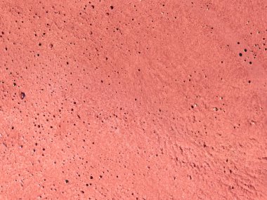 Parlak turuncu beton ya da alçı duvar dokusu, ince gözenekli yüzey ve doğal tahıl. Modern tasarım, markalaşma, sosyal medya şablonları, posterler ve yaratıcı yerleşimler için uygun canlı soyut arkaplan.