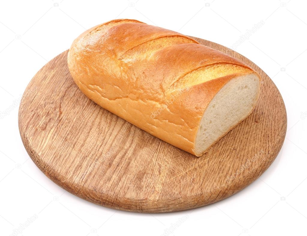 Fresh bread on wooden board isolated white