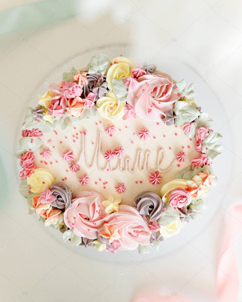 Cake for mom is decorated with cream flowers
