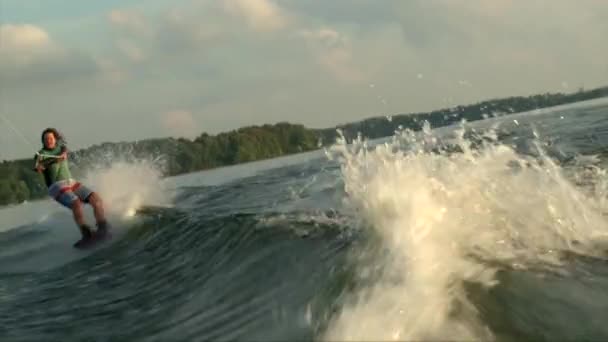 Wakeboarder girl fall in water — Stock Video