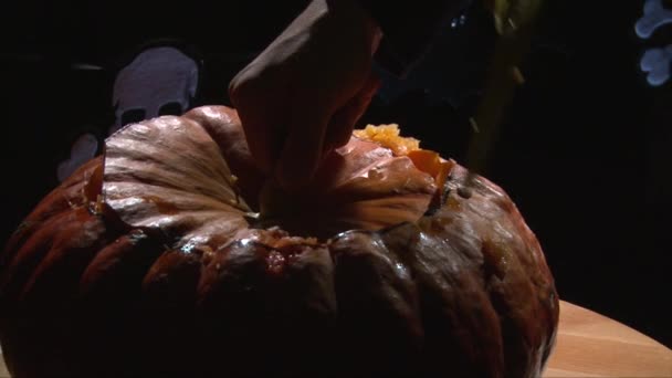 Cutting Halloween Pumpkin Top Part With Knife — Stock Video