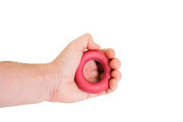 Beyaz arka planda el halkası eğitmeninde genişletme lastiği. Spor aletleri izole edildi