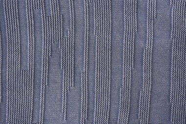 Koyu mavi doku, doğal iplikten yapılmış.
