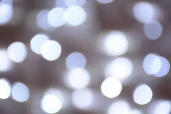 Bokeh gümüşü arka planda bulanık. Soyut bokeh ışık renkli arkaplan