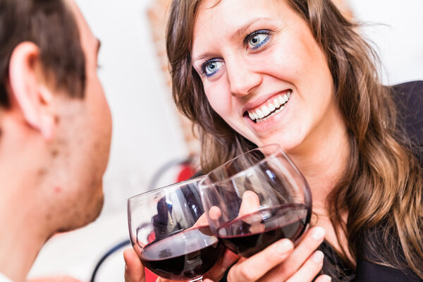 Man and woman drinking wine and talking